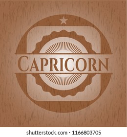 Capricorn badge with wooden background