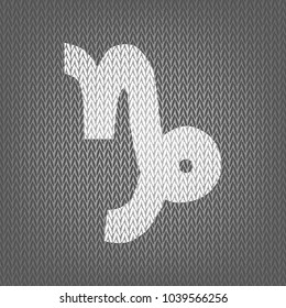 Capricorn sign illustration. Vector. White knitted icon on gray knitted background. Isolated.