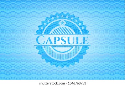 Capsule light blue water wave badge.