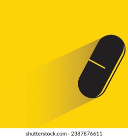 capsule with shadow on yellow background