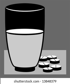 capsules and a glass	
