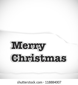 Caption merry christmas with shadow on a piece of paper