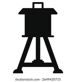 Captured in a silhouette, the image highlights a water tank distinctly mounted on a robust four legged support. The background remains transparent enhancing focus.