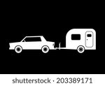 Car and caravan on black background