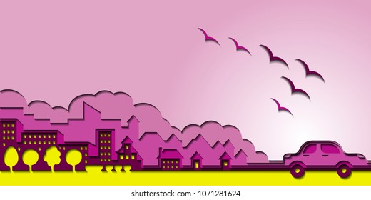 A car and a city made of several layers of colored paper. Paper background.