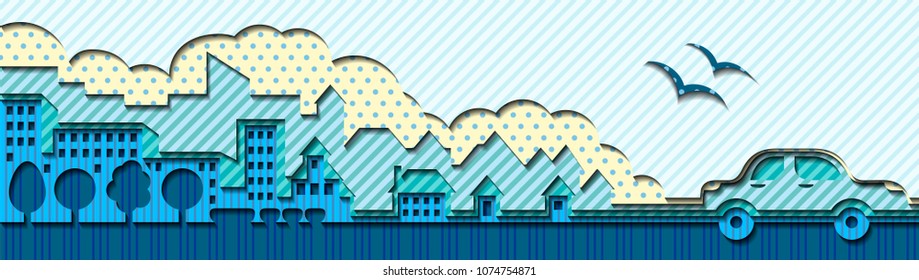 A car and a city made of several layers of colored paper.