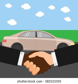 Car dealer and client shaking hands