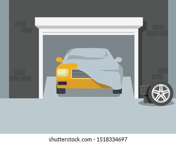 a car inside of the garage with car cover