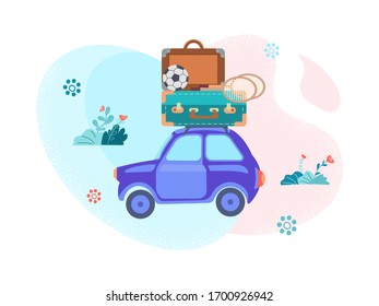A car with luggage on the roof - a suitcase, badminton racket, soccer ball - goes on vacation in the background of the landscape