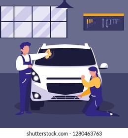 car in maintenance workshop with mechanics team