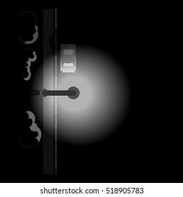 the car on the night road under a streetlight