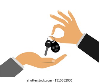 Car sale. Handing over the keys to the car from hand to hand. Car keys with remote control.