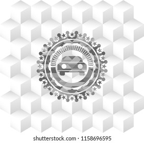car seen from front icon inside grey emblem with cube white background