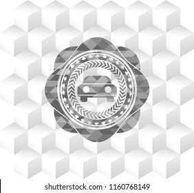 car seen from front icon inside grey badge with geometric cube white background
