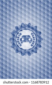 car seen from front icon inside blue badge with geometric pattern background.