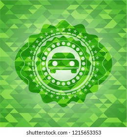 car seen from front icon inside green emblem. Mosaic background
