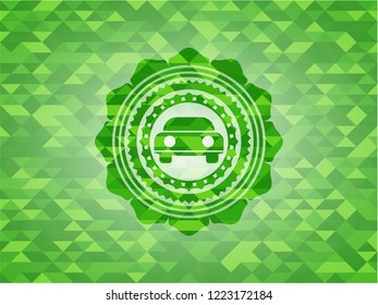 car seen from front icon inside green emblem with triangle mosaic background