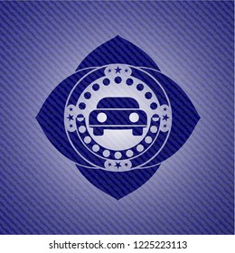 car seen from front icon inside emblem with jean background