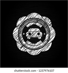 car seen from front icon inside chalkboard emblem on black board