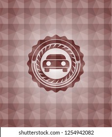 car seen from front icon inside red seamless emblem with geometric pattern.