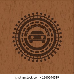 car seen from front icon inside badge with wood background