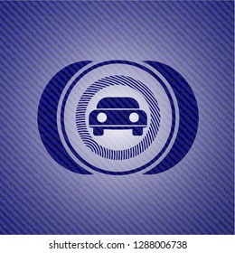car seen from front icon inside emblem with jean background