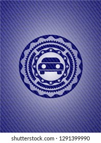car seen from front icon inside badge with denim background