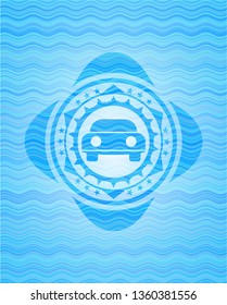 car seen from front icon inside light blue water wave emblem background.