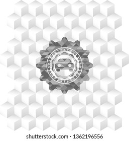 car seen from front icon inside grey badge with geometric cube white background