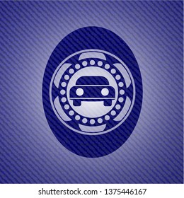 car seen from front icon inside emblem with jean background