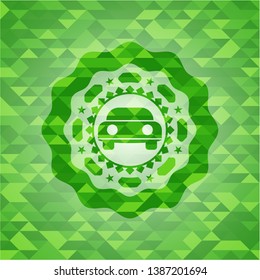 car seen from front icon inside realistic green mosaic emblem