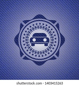 car seen from front icon inside emblem with jean background