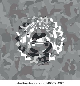 car seen from front icon inside grey camouflaged emblem