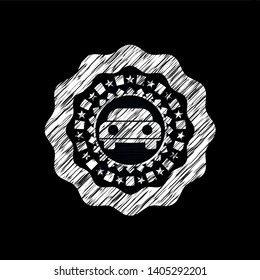 car seen from front icon inside chalkboard emblem written on a blackboard