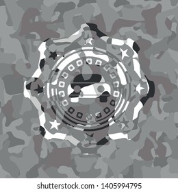 car seen from front icon inside grey camo emblem