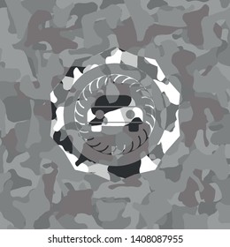 car seen from front icon inside grey camouflaged emblem