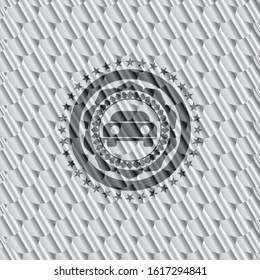 car seen from front icon inside shiny silver emblem. Scales pattern. Vector Illustration. Detailed.