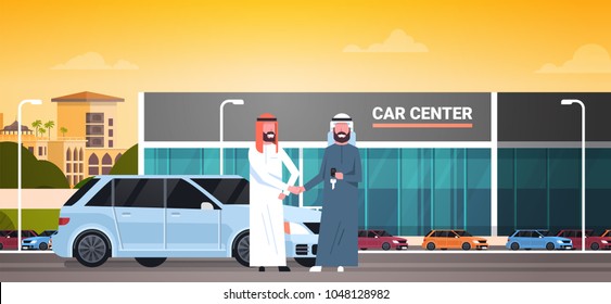 Car Showroom Background, Purchase Sale Or Rental Center Arab Seller Man Giving Keys To Owner