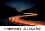 Car speed lights. Glowing trail, highway road line, fast and long night exposure, red lane blurred effect. Mountains and night sky. Vector abstract background with dynamic flashlight