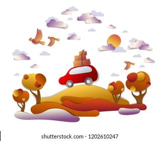 Car travel and tourism in autumn, red minivan with luggage riding off road in orange fall meadows among trees, birds and clouds in the sky, paper cut vector illustration of auto in scenic landscape.