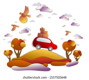 Car travel and tourism in autumn, red minivan with luggage riding off road in orange fall meadows among trees, birds and clouds in the sky, paper cut vector illustration of auto in scenic landscape.
