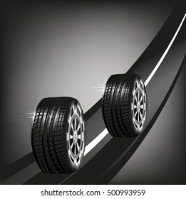 Car tyres on the road isolated on black background