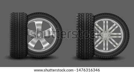 Car wheels with summer tire and winter tire with spikes