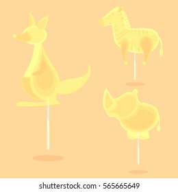 Caramel candy on a stick in the form of cartoon animals for kids. For the holidays