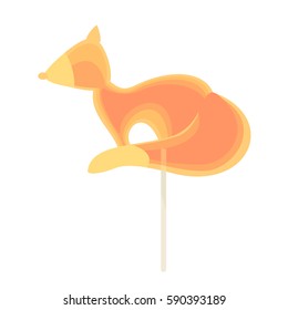 Caramel candy on a stick in the form of a fox. For the holidays.
