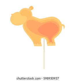 Caramel candy on a stick in the form of a large hippopotamus. For children on holidays.
