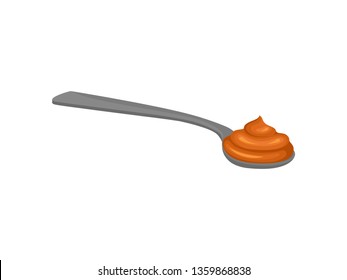 Caramel in spoon on white background. Candy concept.
