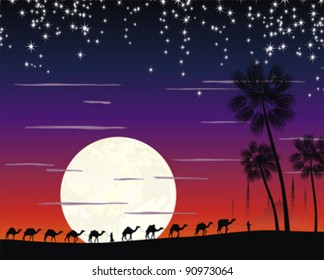 caravan of camels in the desert near the mosque under the moon