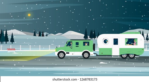 Caravan family travels during the snowy night