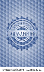 Caravanning blue emblem with geometric background.